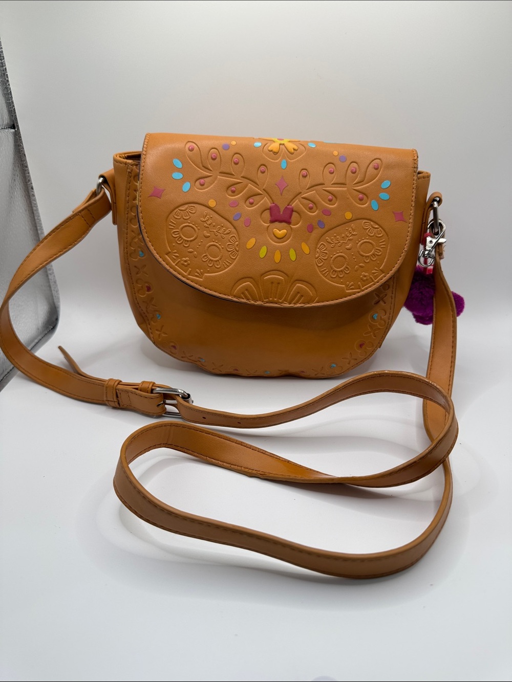 Disney parks Epcot Pavilion Coco Embroidered Floral Saddle Bag Tan